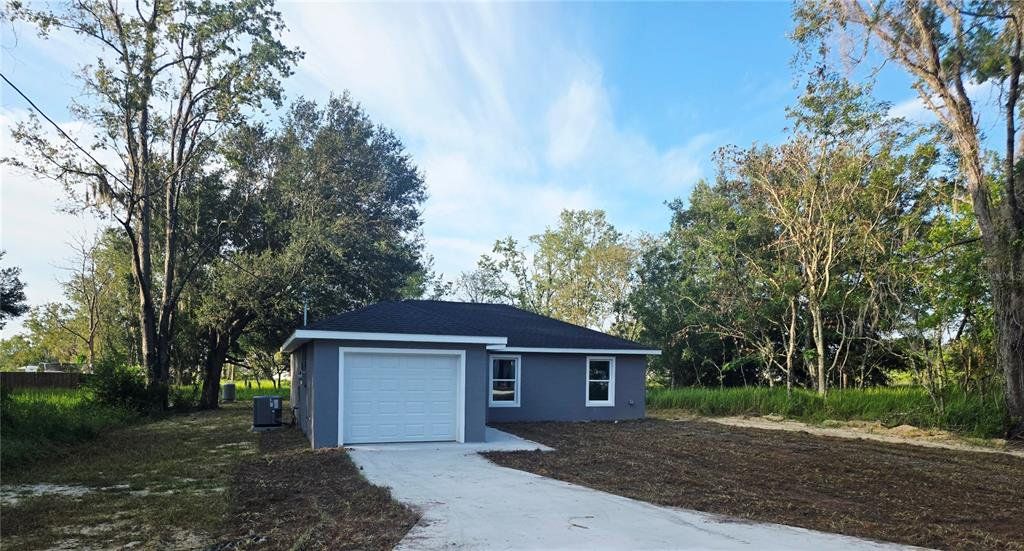 Front exterior of a new home in , Ocala, FL, highlighting curb appeal (Image 1). Front exterior of a new home in , Ocala, FL, highlighting curb appeal (Image 1).