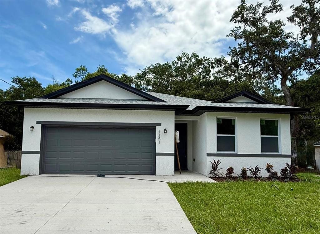 Front exterior of a new home in , Sanford, FL, highlighting curb appeal (Image 1). Front exterior of a new home in , Sanford, FL, highlighting curb appeal (Image 1).