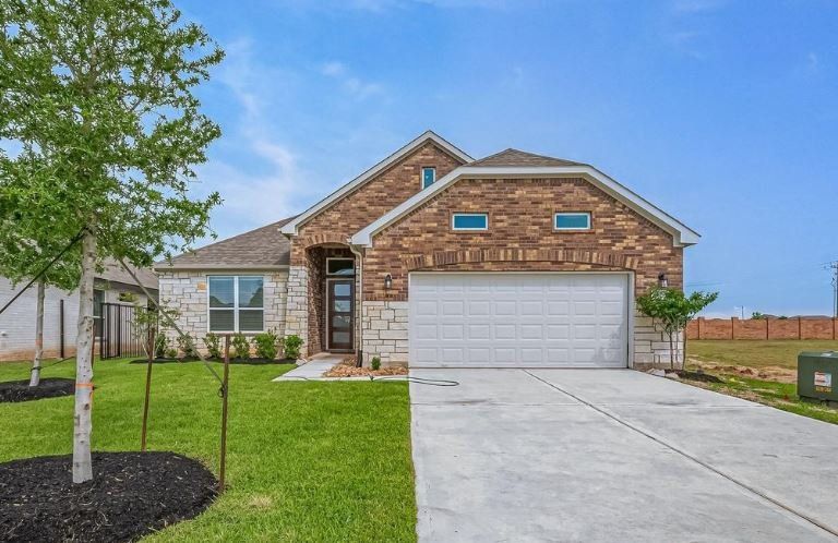 Front exterior of a new home in Lago Mar, Texas City, TX, highlighting curb appeal (Image 1). Front exterior of a new home in Lago Mar, Texas City, TX, highlighting curb appeal (Image 1).