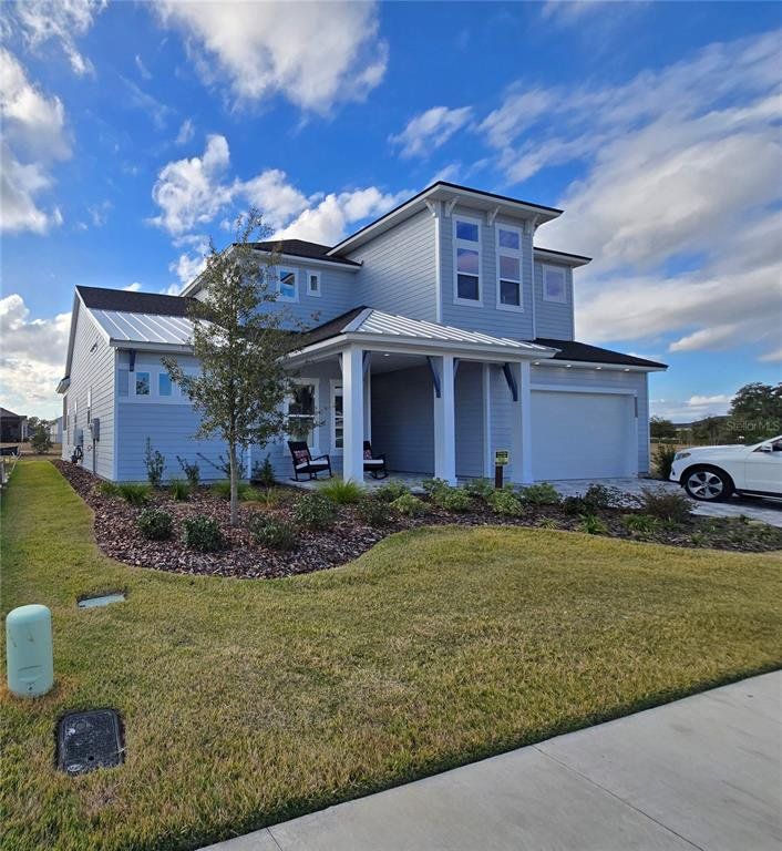 Front exterior of a new home in Oakmont, Gainesville, FL, highlighting curb appeal (Image 1). Front exterior of a new home in Oakmont, Gainesville, FL, highlighting curb appeal (Image 1).