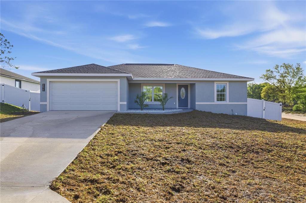 Front exterior of a new home in , Ocala, FL, highlighting curb appeal (Image 1). Front exterior of a new home in , Ocala, FL, highlighting curb appeal (Image 1).