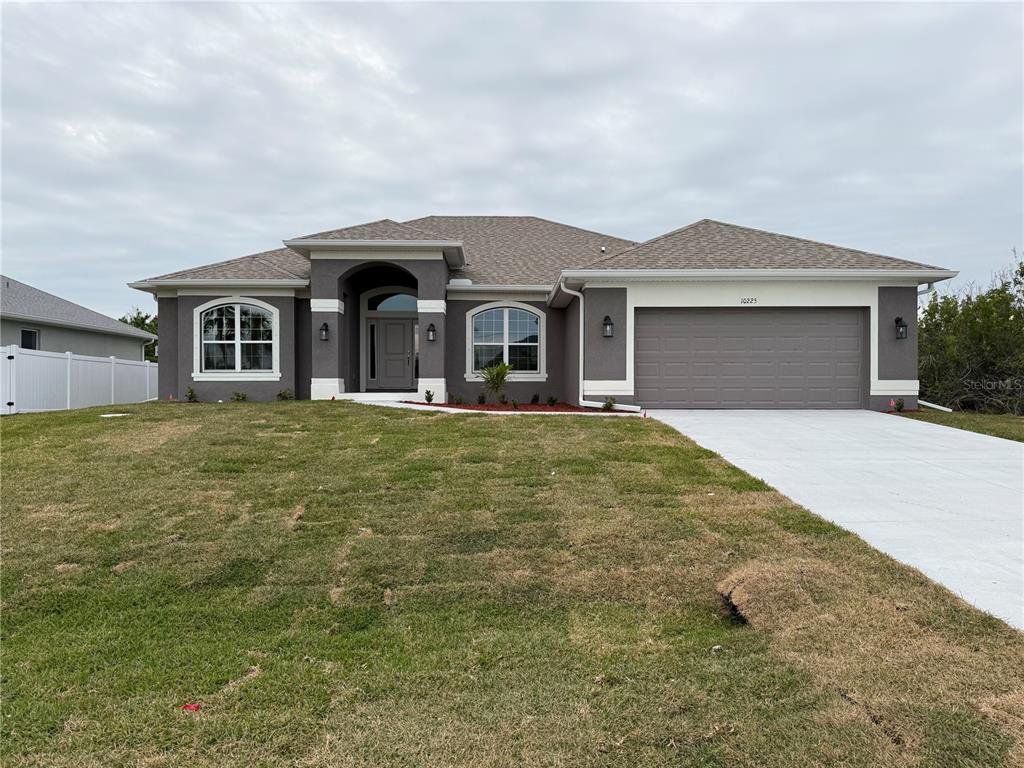 Front exterior of a new home in South Gulf Cove, Port Charlotte, FL, highlighting curb appeal (Image 1). Front exterior of a new home in South Gulf Cove, Port Charlotte, FL, highlighting curb appeal (Image 1).