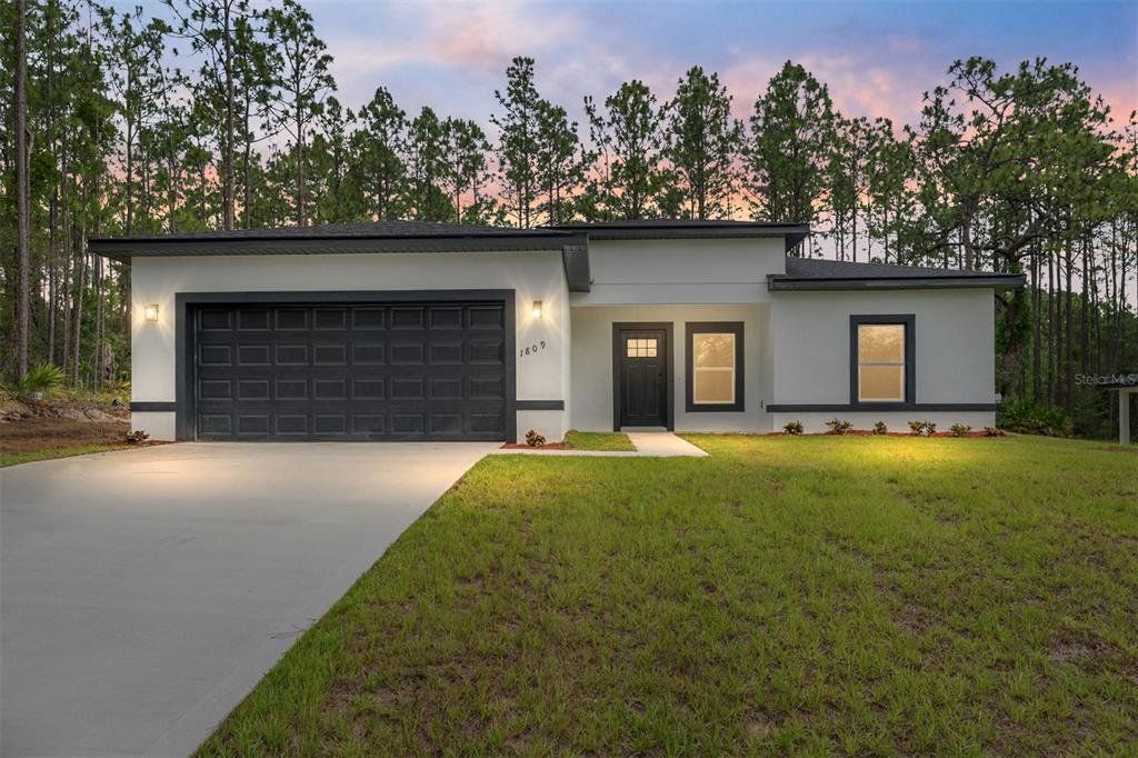 Front exterior of a new home in , Citrus Springs, FL, highlighting curb appeal (Image 1). Front exterior of a new home in , Citrus Springs, FL, highlighting curb appeal (Image 1).