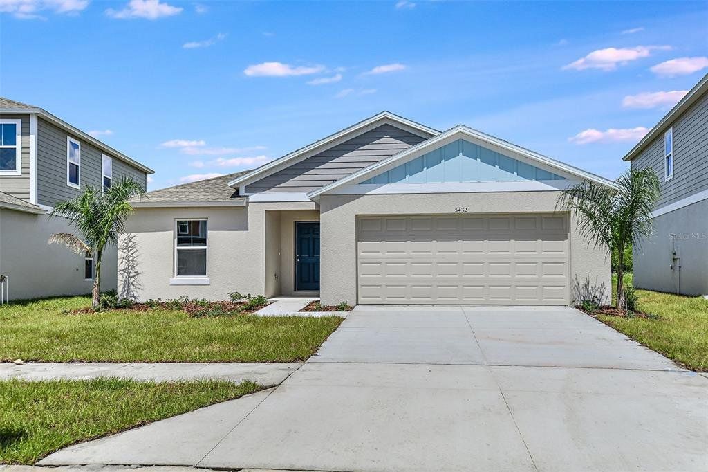 Front exterior of a new home in Crosswinds, Haines City, FL, highlighting curb appeal (Image 1). Front exterior of a new home in Crosswinds, Haines City, FL, highlighting curb appeal (Image 1).