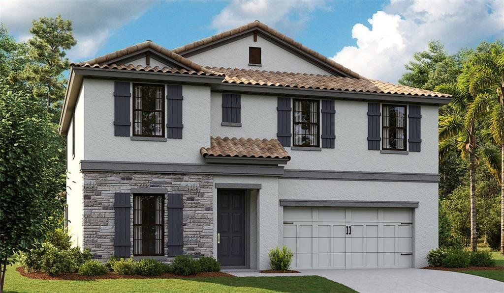 Front exterior of a new home in Crosswind Ranch, Parrish, FL, highlighting curb appeal (Image 1). Front exterior of a new home in Crosswind Ranch, Parrish, FL, highlighting curb appeal (Image 1).