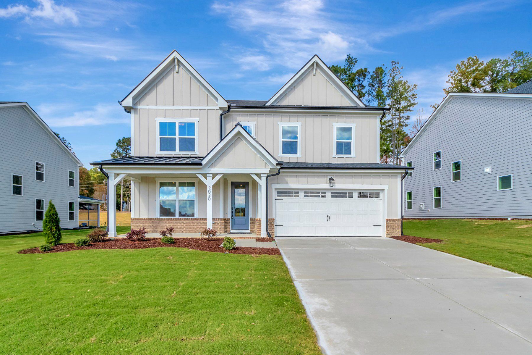 Front exterior of a new home in Stonewood Estates: Legacy, Durham, NC, highlighting curb appeal (Image 1). Front exterior of a new home in Stonewood Estates: Legacy, Durham, NC, highlighting curb appeal (Image 1).