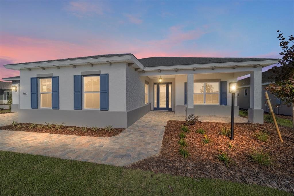 Front exterior of a new home in On Top of the World Communities, Ocala, FL, highlighting curb appeal (Image 1). Front exterior of a new home in On Top of the World Communities, Ocala, FL, highlighting curb appeal (Image 1).