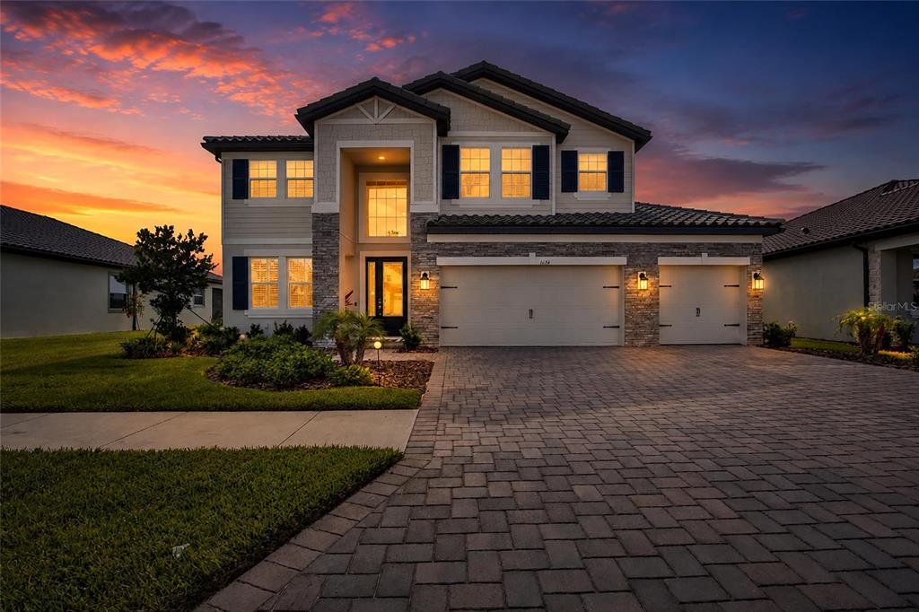 Front exterior of a new home in , Wesley Chapel, FL, highlighting curb appeal (Image 1). Front exterior of a new home in , Wesley Chapel, FL, highlighting curb appeal (Image 1).