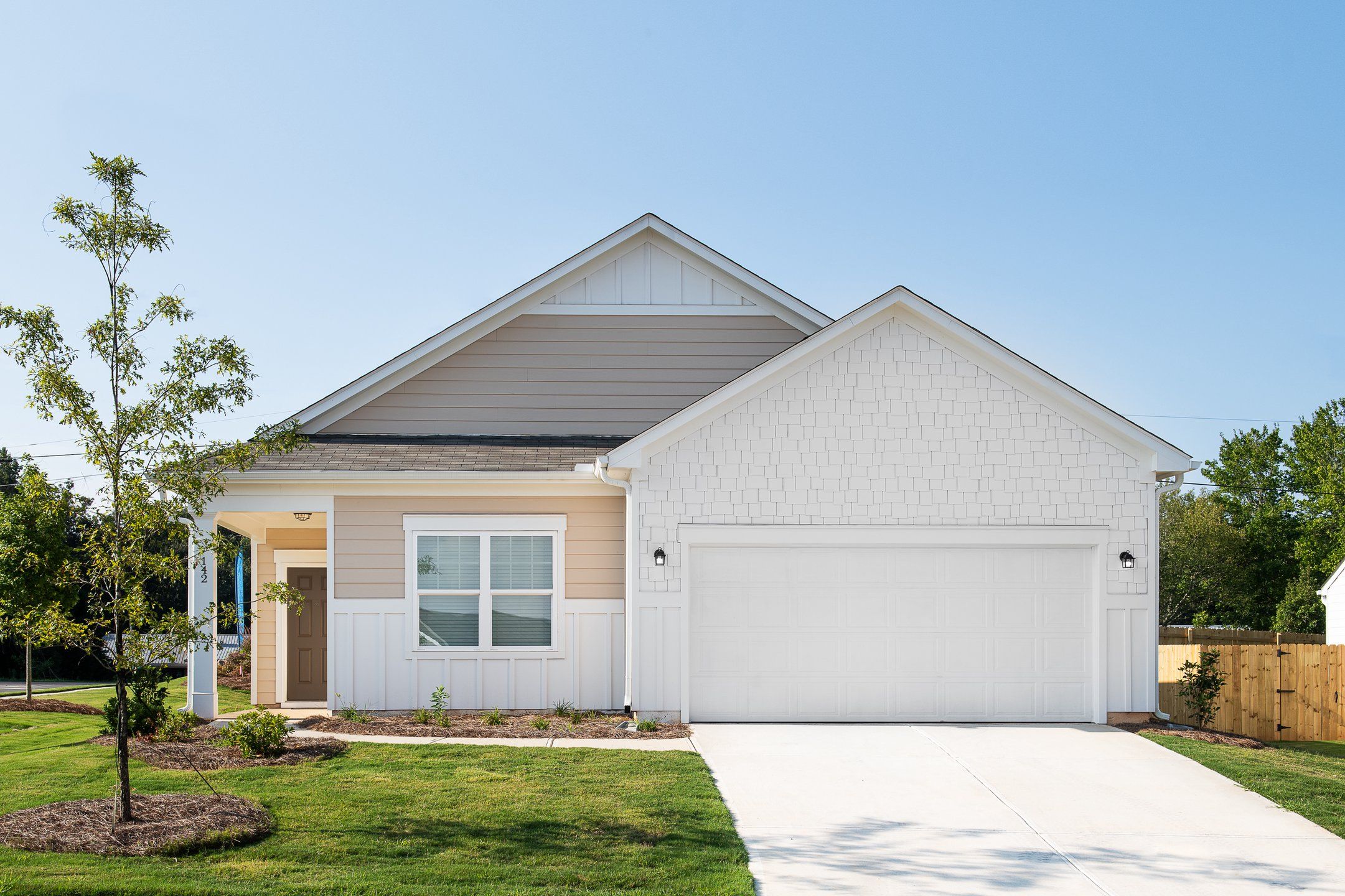 Front exterior of a new home in The Summit at Carters Station, Columbia, TN, highlighting curb appeal (Image 1). Front exterior of a new home in The Summit at Carters Station, Columbia, TN, highlighting curb appeal (Image 1).