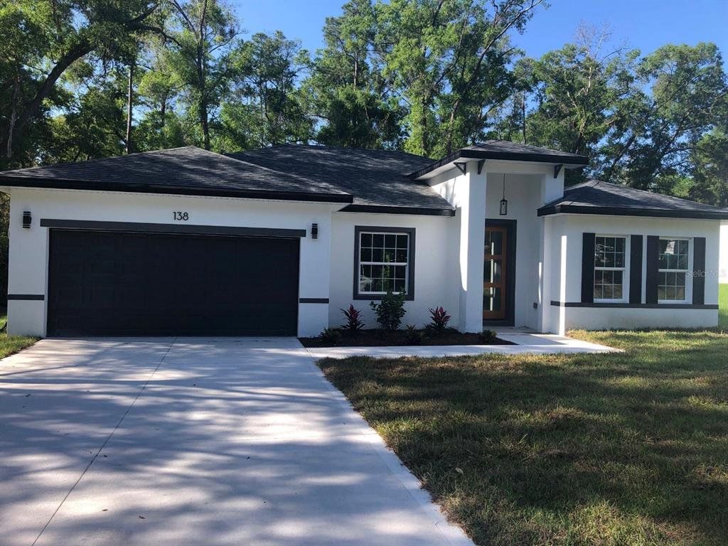 Front exterior of a new home in , Ocala, FL, highlighting curb appeal (Image 1). Front exterior of a new home in , Ocala, FL, highlighting curb appeal (Image 1).