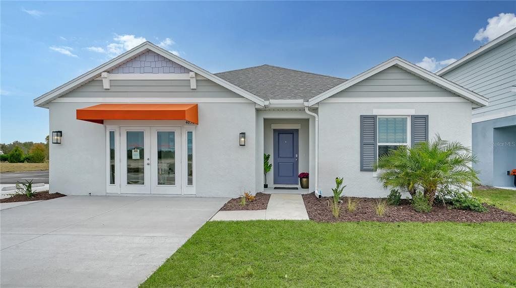 Front exterior of a new home in Broadleaf, Parrish, FL, highlighting curb appeal (Image 1). Front exterior of a new home in Broadleaf, Parrish, FL, highlighting curb appeal (Image 1).