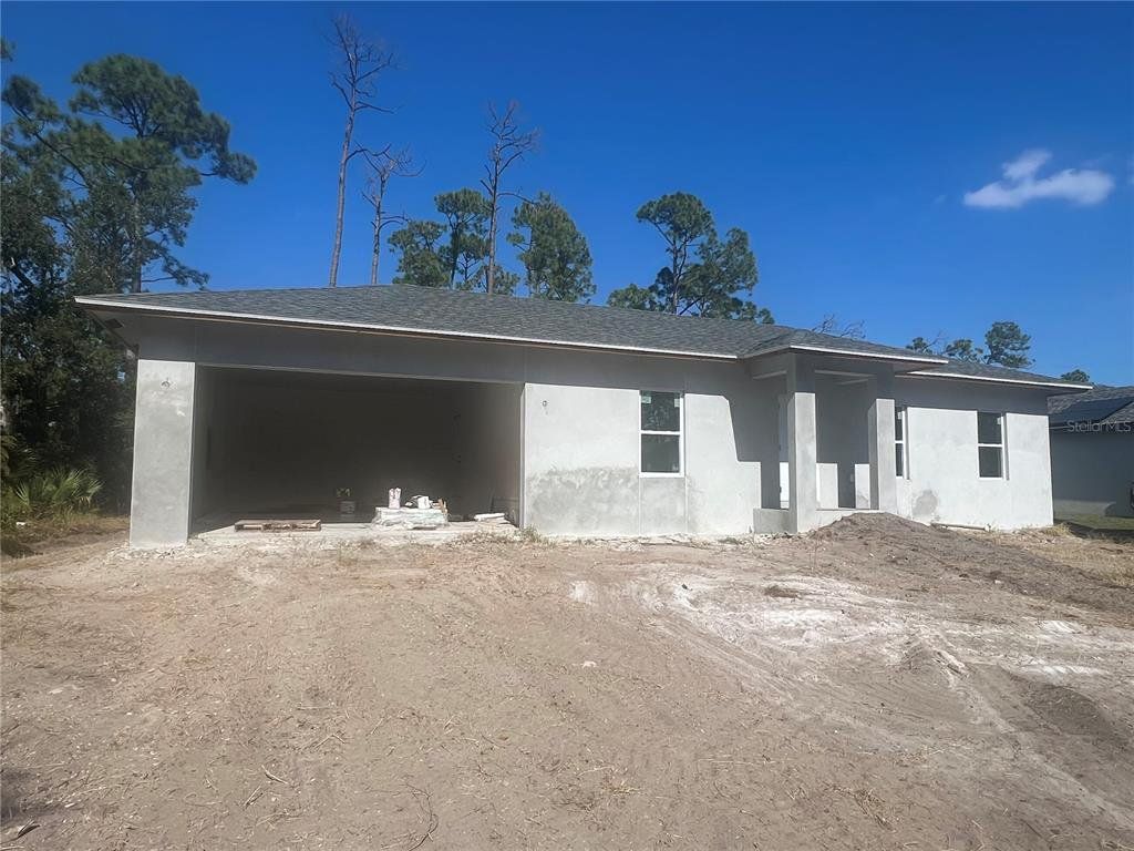 In-progress construction of a new home in , Port Charlotte, FL (Image 1).