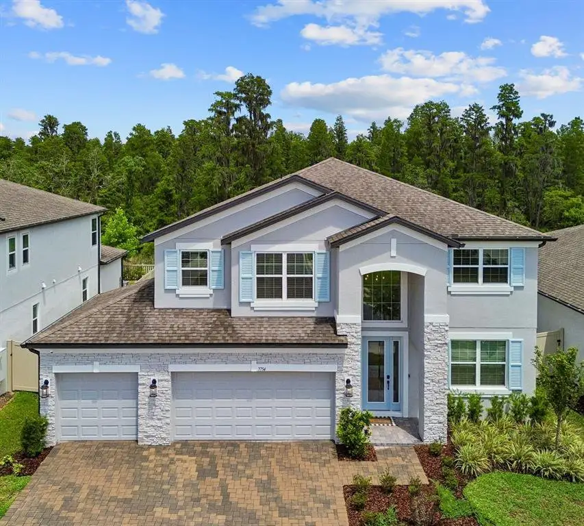 Front exterior of a new home in Whispering Oaks Preserve, Wesley Chapel, FL, highlighting curb appeal (Image 1). Front exterior of a new home in Whispering Oaks Preserve, Wesley Chapel, FL, highlighting curb appeal (Image 1).