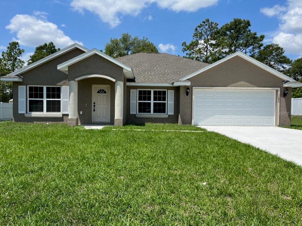 Front exterior of a new home in , Ocala, FL, highlighting curb appeal (Image 1). Front exterior of a new home in , Ocala, FL, highlighting curb appeal (Image 1).