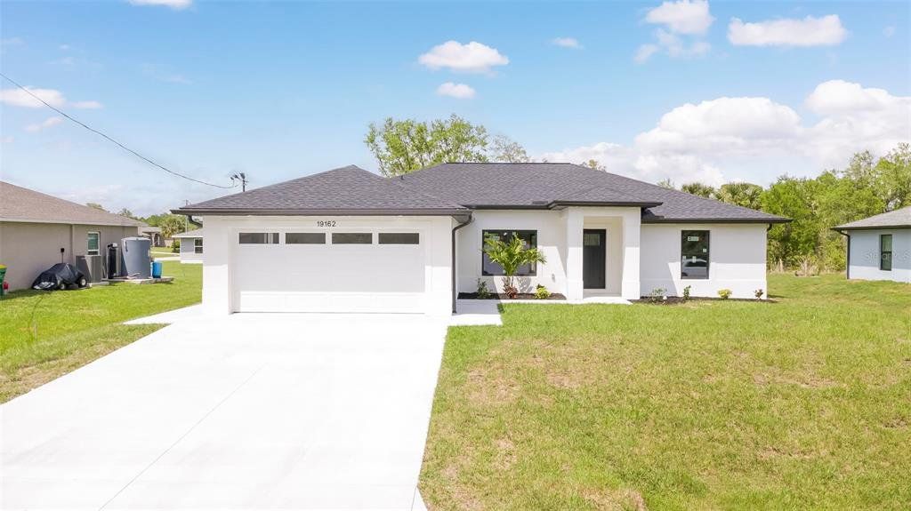 Front exterior of a new home in , Port Charlotte, FL, highlighting curb appeal (Image 1). Front exterior of a new home in , Port Charlotte, FL, highlighting curb appeal (Image 1).