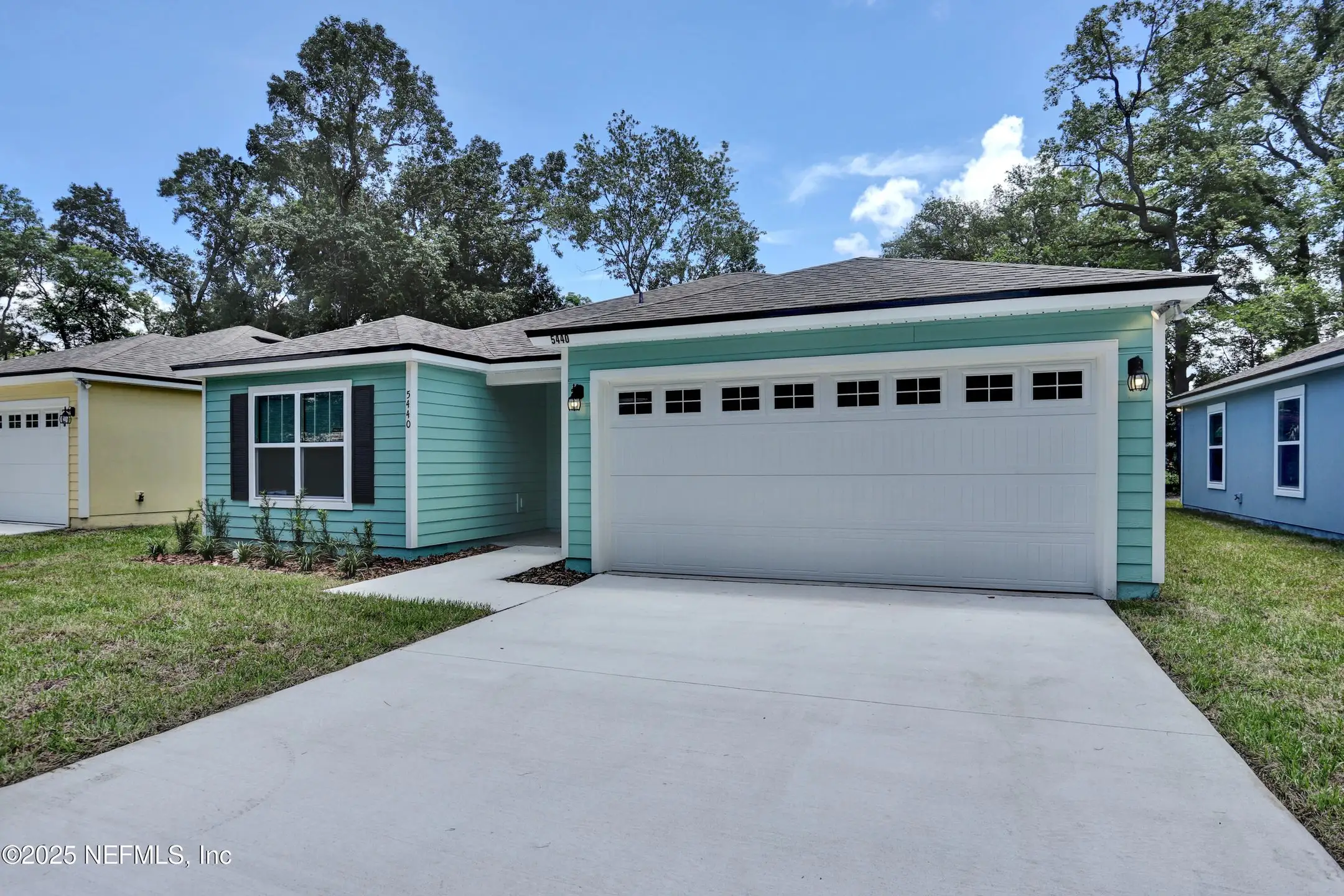 Front exterior of a new home in , Jacksonville, FL, highlighting curb appeal (Image 1).