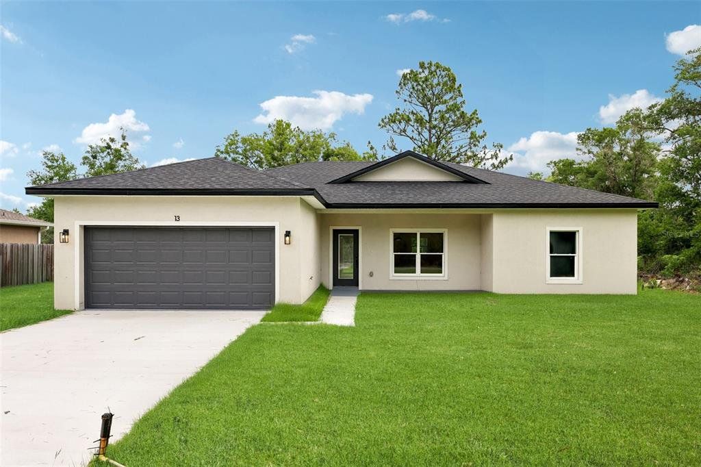 Front exterior of a new home in , Ocklawaha, FL, highlighting curb appeal (Image 1). Front exterior of a new home in , Ocklawaha, FL, highlighting curb appeal (Image 1).