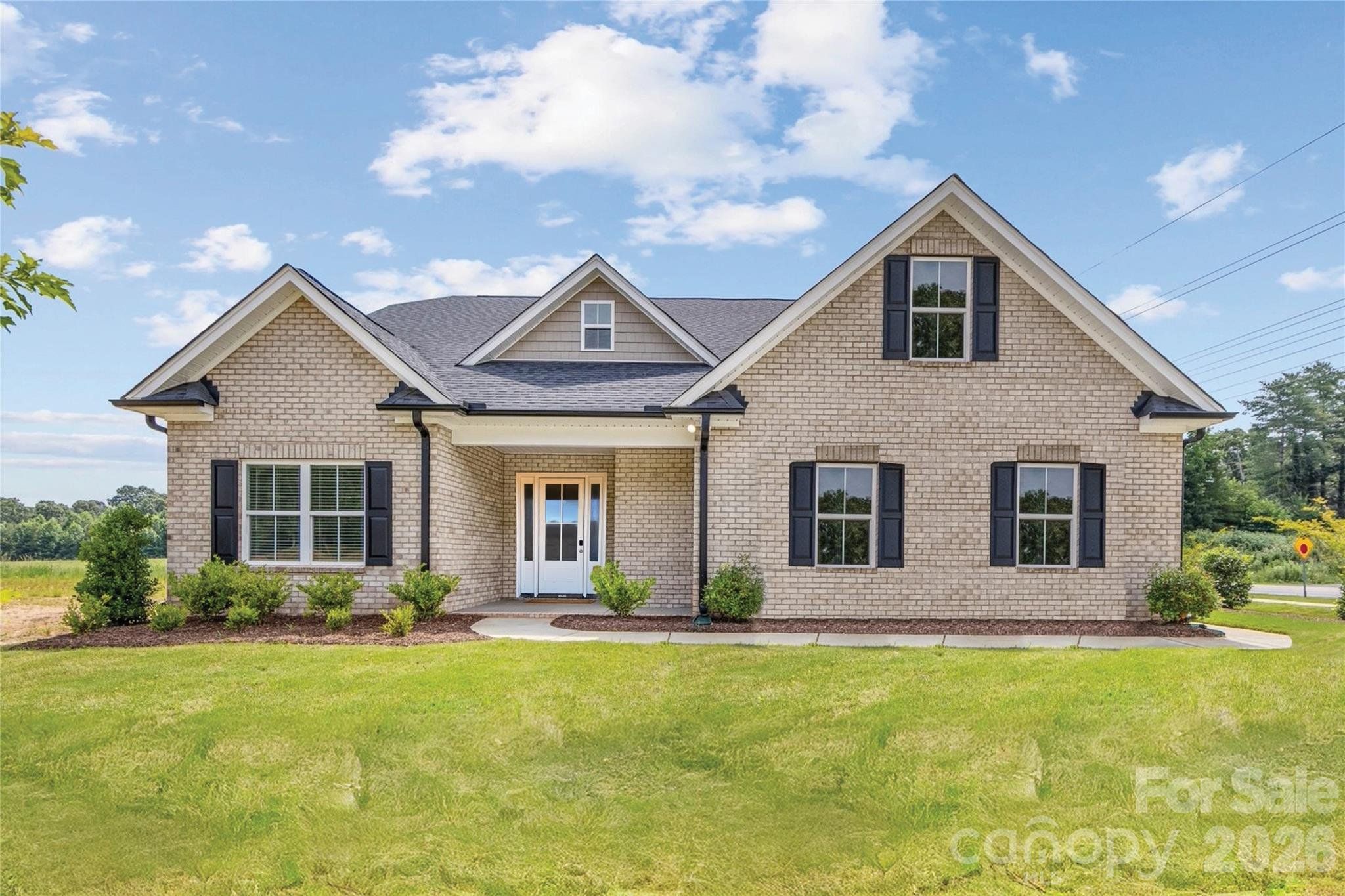 Front exterior of a new home in , Unionville, NC, highlighting curb appeal (Image 1). Front exterior of a new home in , Unionville, NC, highlighting curb appeal (Image 1).