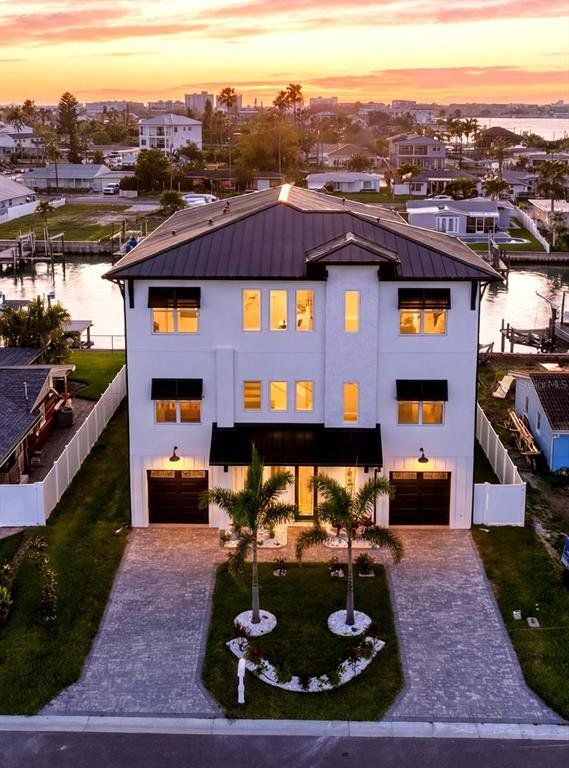 Front exterior of a new home in , Madeira Beach, FL, highlighting curb appeal (Image 1). Front exterior of a new home in , Madeira Beach, FL, highlighting curb appeal (Image 1).