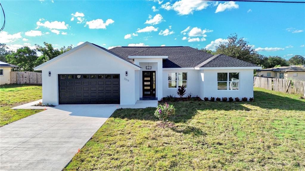 Front exterior of a new home in , Avon Park, FL, highlighting curb appeal (Image 1). Front exterior of a new home in , Avon Park, FL, highlighting curb appeal (Image 1).