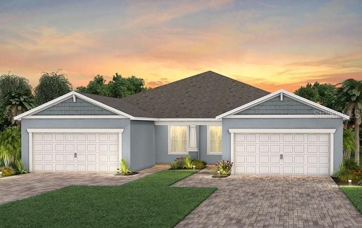 Front exterior of a new home in Del Webb Sunbridge, St. Cloud, FL, highlighting curb appeal (Image 1). Front exterior of a new home in Del Webb Sunbridge, St. Cloud, FL, highlighting curb appeal (Image 1).