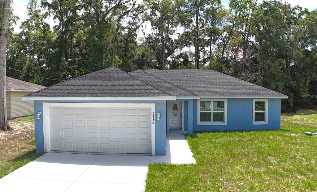 Front exterior of a new home in , Ocala, FL, highlighting curb appeal (Image 1). Front exterior of a new home in , Ocala, FL, highlighting curb appeal (Image 1).
