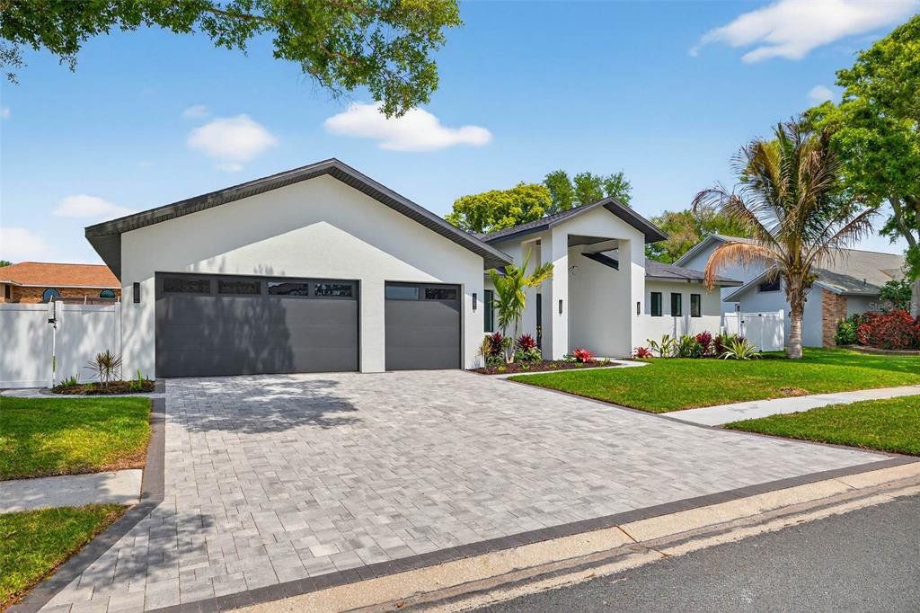 Front exterior of a new home in , Largo, FL, highlighting curb appeal (Image 1). Front exterior of a new home in , Largo, FL, highlighting curb appeal (Image 1).