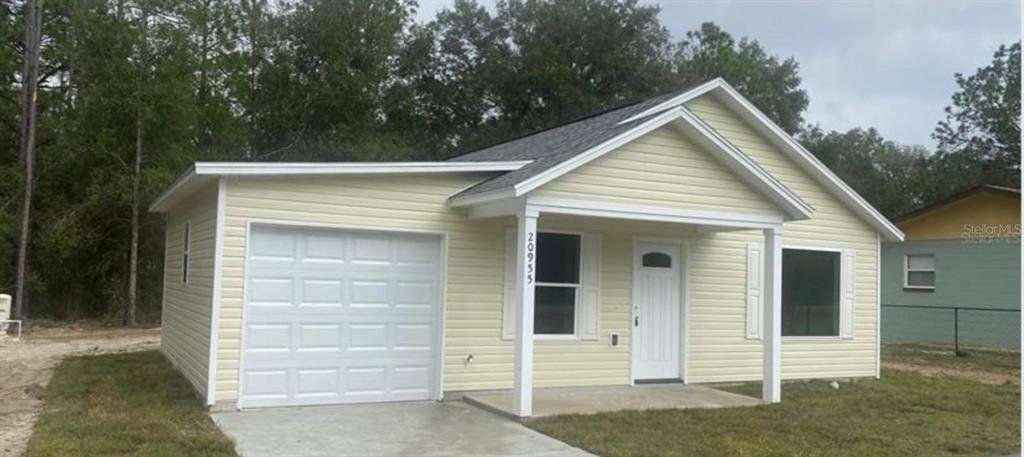 Front exterior of a new home in , Ocala, FL, highlighting curb appeal (Image 1). Front exterior of a new home in , Ocala, FL, highlighting curb appeal (Image 1).