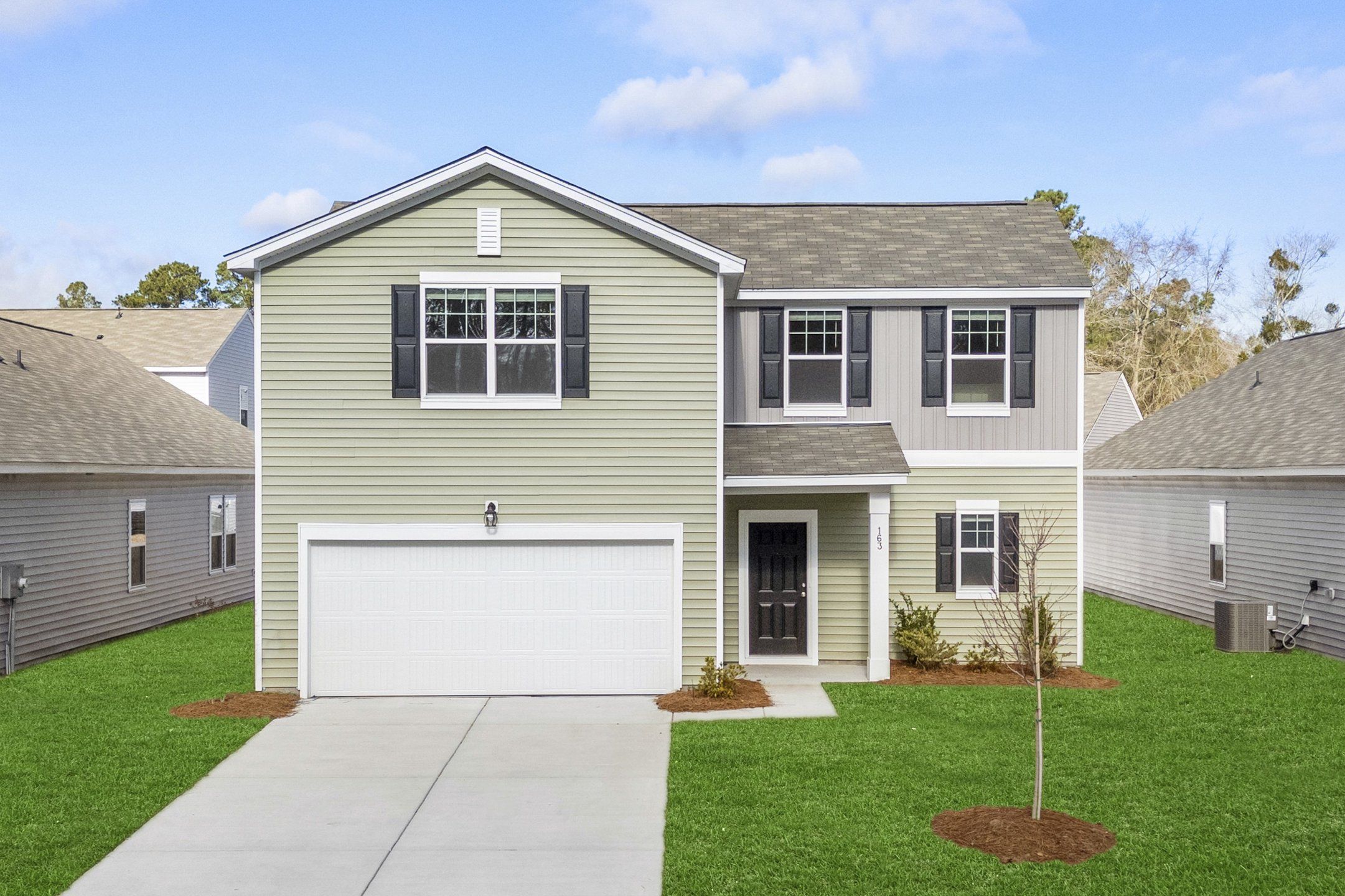 Front exterior of a new home in Bayview, Conway, SC, highlighting curb appeal (Image 1).