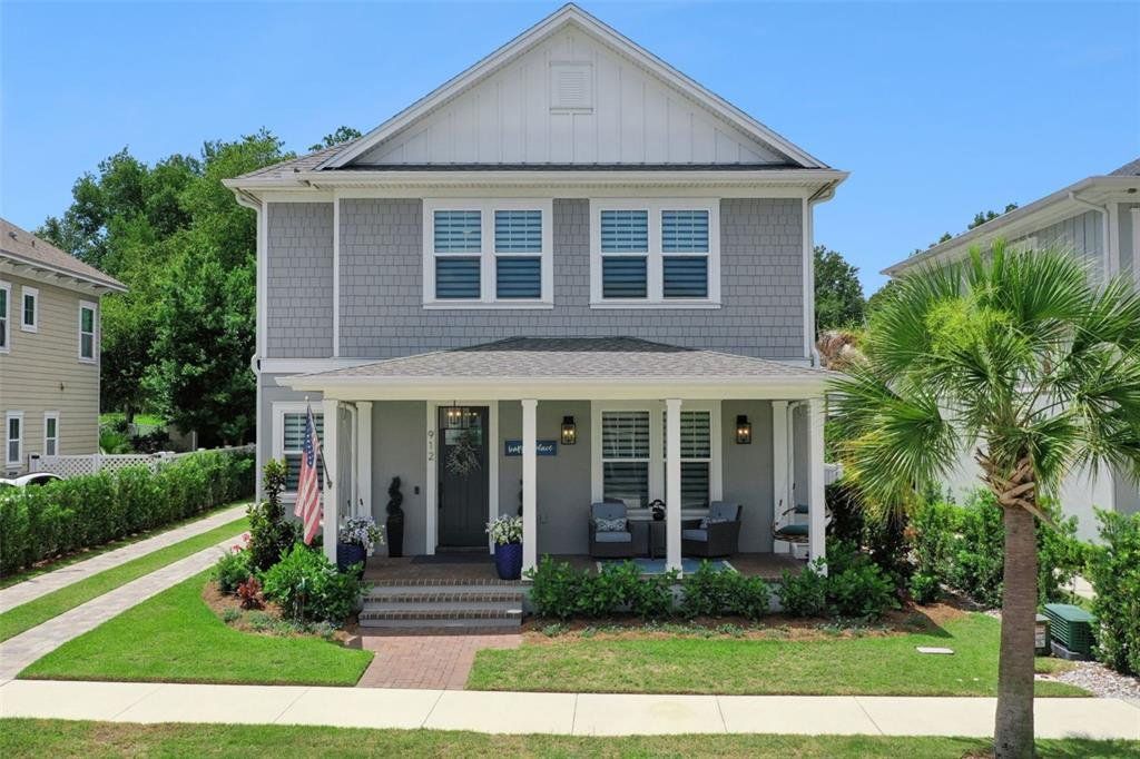 Front exterior of a new home in Oakland Park, Winter Garden, FL, highlighting curb appeal (Image 1). Front exterior of a new home in Oakland Park, Winter Garden, FL, highlighting curb appeal (Image 1).