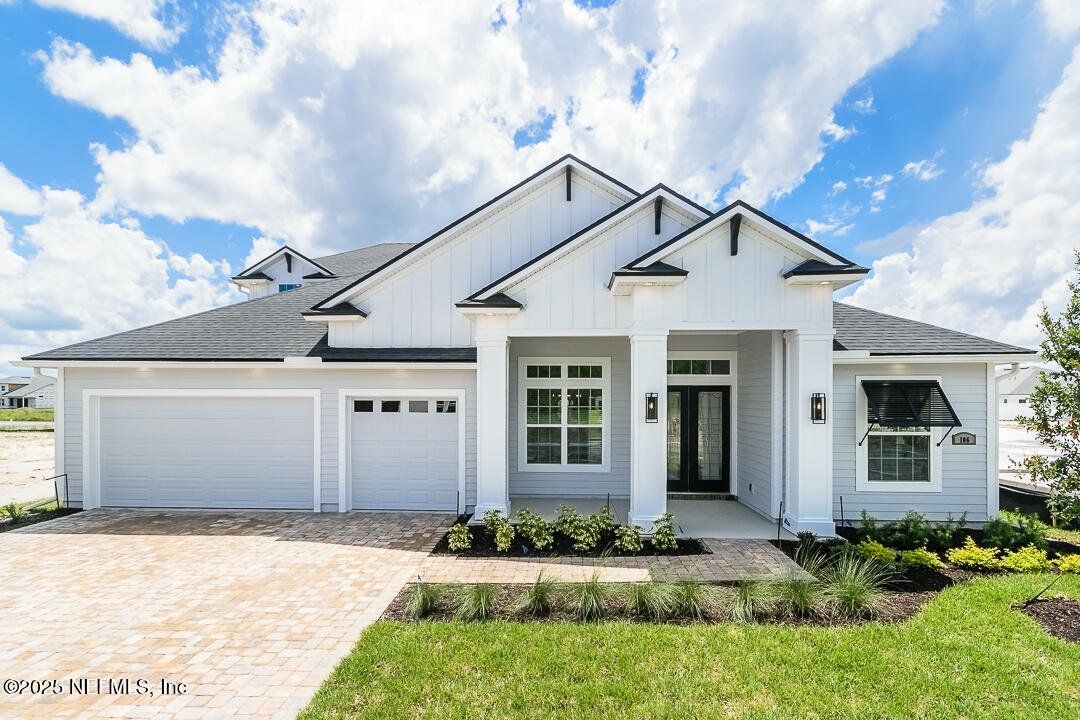 Front exterior of a new home in Silver Landing At Silverleaf, St. Augustine, FL, highlighting curb appeal (Image 1). Front exterior of a new home in Silver Landing At Silverleaf, St. Augustine, FL, highlighting curb appeal (Image 1).