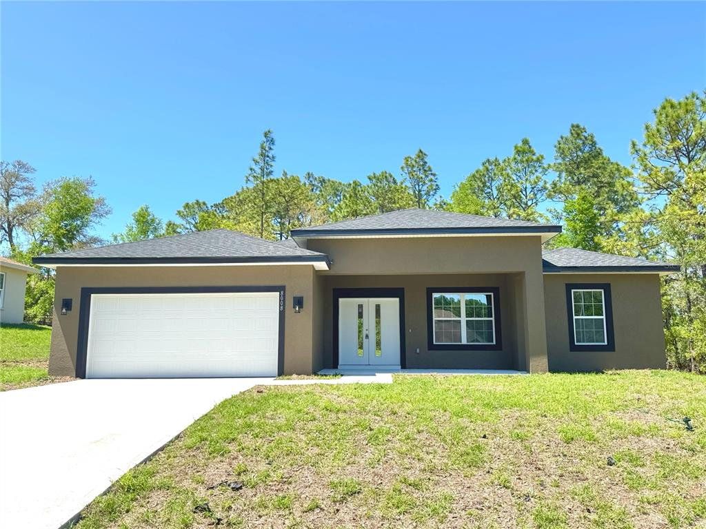Front exterior of a new home in , Citrus Springs, FL, highlighting curb appeal (Image 1). Front exterior of a new home in , Citrus Springs, FL, highlighting curb appeal (Image 1).
