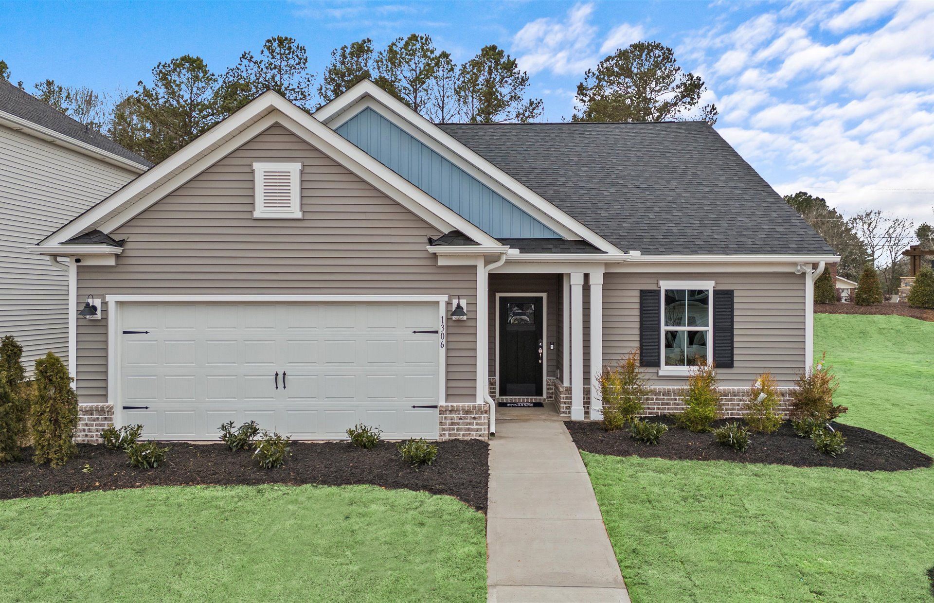 Front exterior of a new home in Briarwood Reserve, Spartanburg, SC, highlighting curb appeal (Image 1). Front exterior of a new home in Briarwood Reserve, Spartanburg, SC, highlighting curb appeal (Image 1).