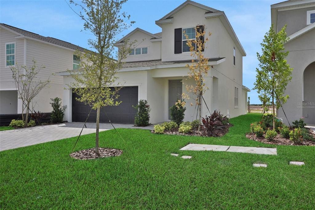Front exterior of a new home in Turnleaf, Punta Gorda, FL, highlighting curb appeal (Image 1). Front exterior of a new home in Turnleaf, Punta Gorda, FL, highlighting curb appeal (Image 1).