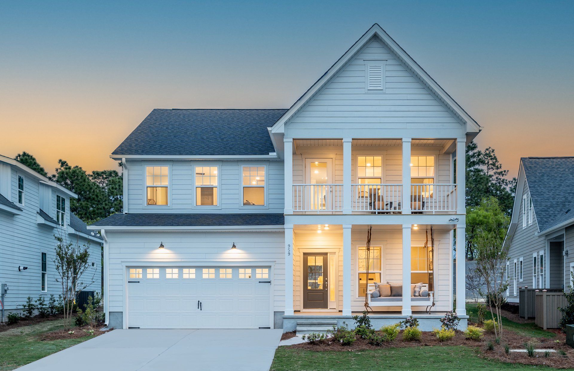 Front exterior of a new home in Riverlights, Wilmington, NC, highlighting curb appeal (Image 1).