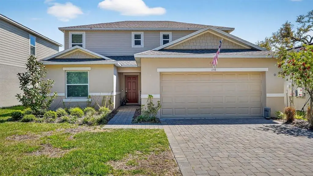 Front exterior of a new home in Riverfront, Edgewater, FL, highlighting curb appeal (Image 1). Front exterior of a new home in Riverfront, Edgewater, FL, highlighting curb appeal (Image 1).