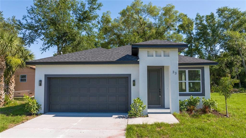 Front exterior of a new home in , Apopka, FL, highlighting curb appeal (Image 1). Front exterior of a new home in , Apopka, FL, highlighting curb appeal (Image 1).