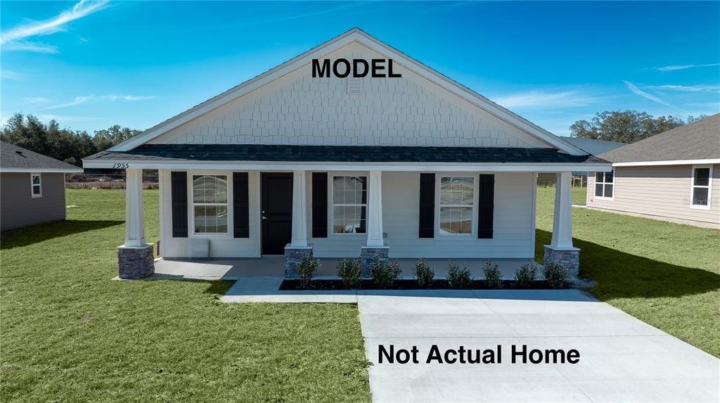 Front exterior of a new home in Rolling Hills, Bell, FL, highlighting curb appeal (Image 1). Front exterior of a new home in Rolling Hills, Bell, FL, highlighting curb appeal (Image 1).