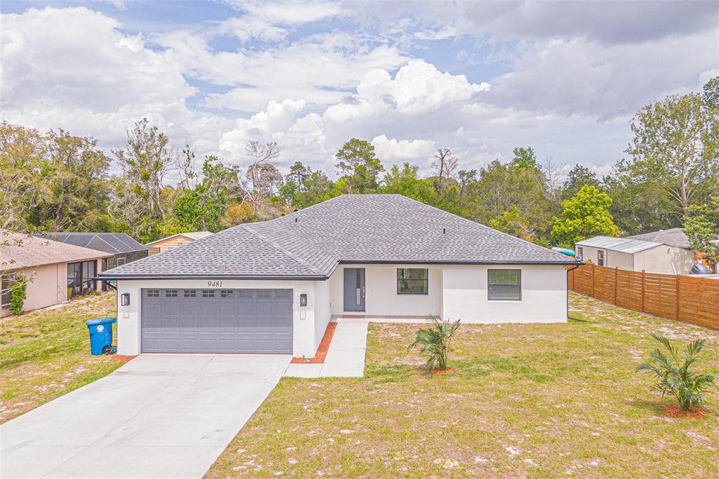 Front exterior of a new home in , Spring Hill, FL, highlighting curb appeal (Image 1). Front exterior of a new home in , Spring Hill, FL, highlighting curb appeal (Image 1).