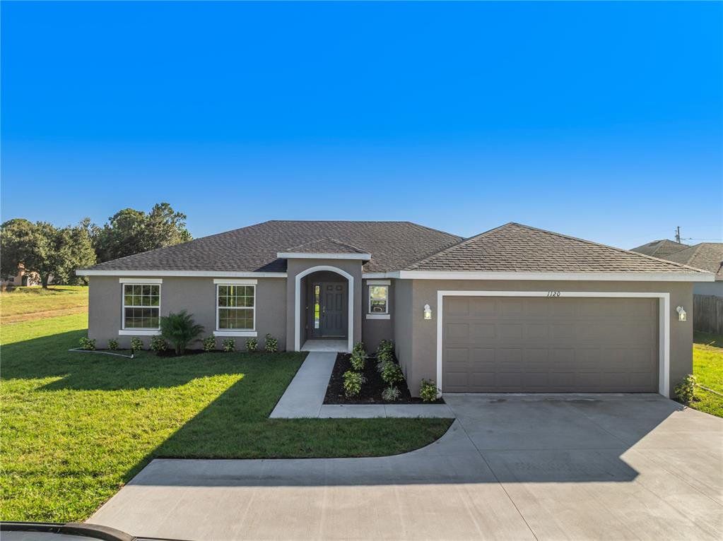 Front exterior of a new home in , Kissimmee, FL, highlighting curb appeal (Image 1). Front exterior of a new home in , Kissimmee, FL, highlighting curb appeal (Image 1).