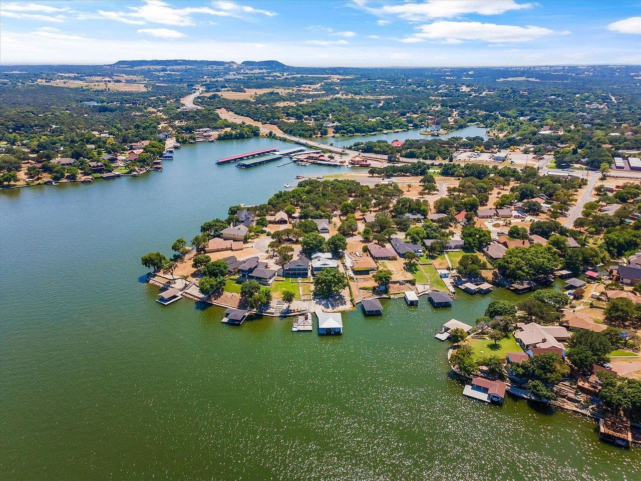 Aerial view of the Hood County community in Granbury, TX, showing layout and nearby surroundings (Image 2). Aerial view of the Hood County community in Granbury, TX, showing layout and nearby surroundings (Image 2).