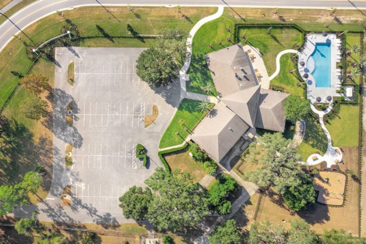 A large building with a parking lot. A large building with a parking lot.