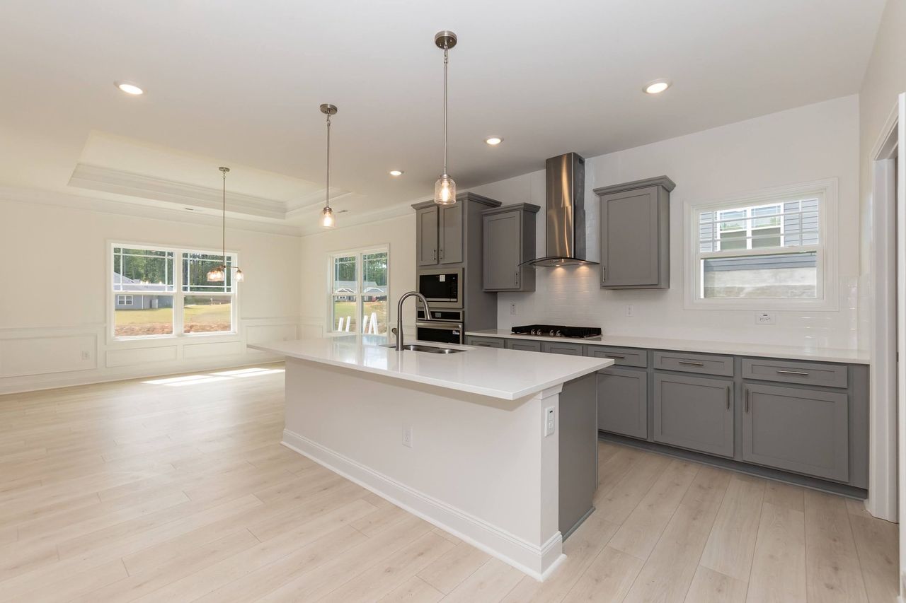 Furnished interior in a model home at Charlotte's Ridge in Middlesex (Image 2).