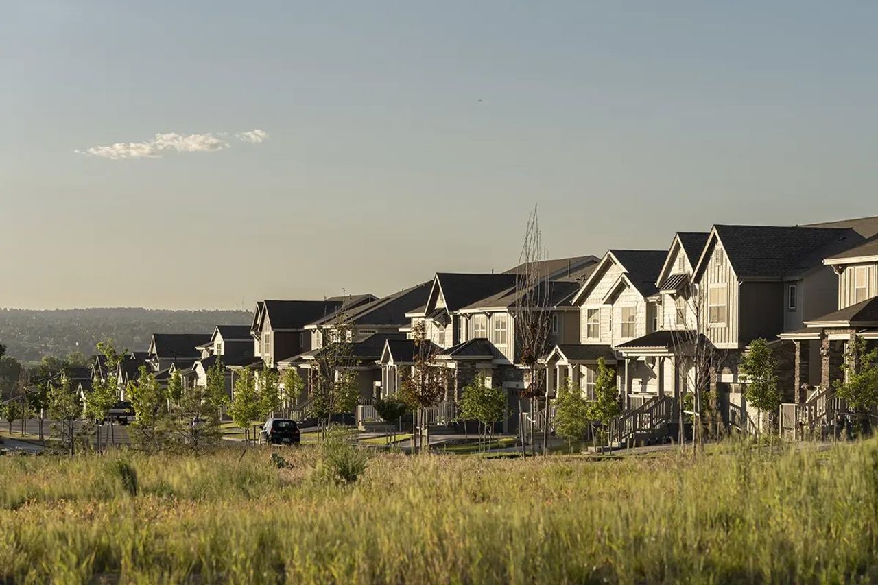 Front exterior of a home in the The Duos at Looking Glass community, located in Parker, CO (Image 2).