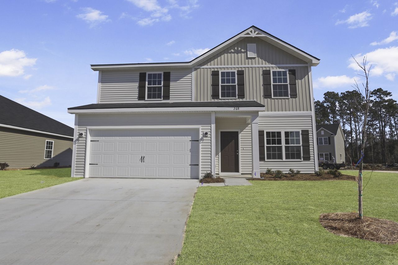 Front exterior of a home in the Grand Reserve community, located in Hinesville, GA (Image 2). Front exterior of a home in the Grand Reserve community, located in Hinesville, GA (Image 2).