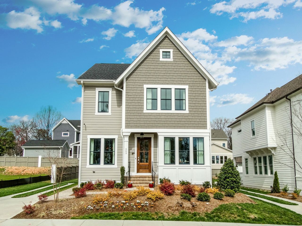 Front exterior of a home in the Oakdale at Mordecai - Raleigh - Robuck Homes community, located in Garner, NC (Image 2).