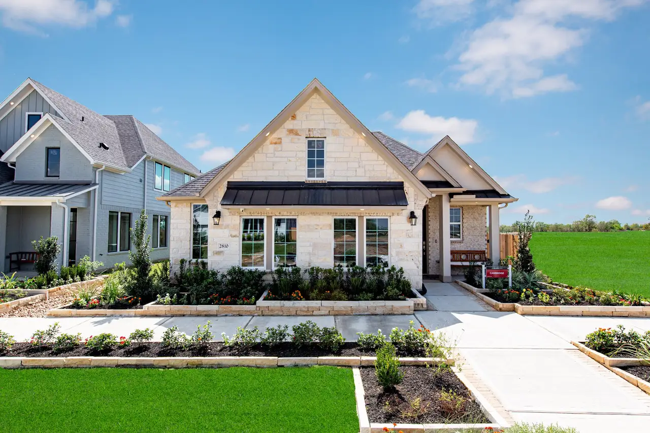 Front exterior of a home in the Meridiana community, located in Iowa Colony, TX (Image 2).