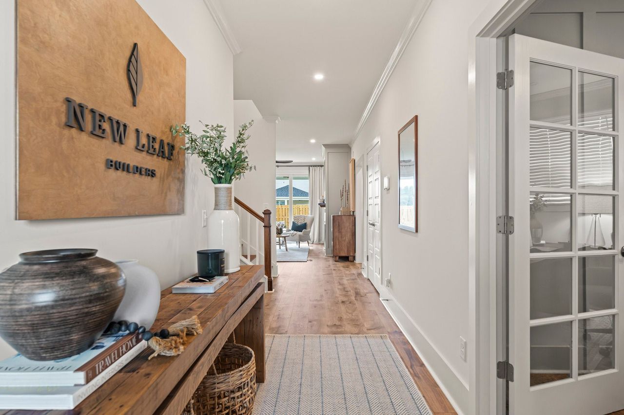 Furnished interior in a model home at East Lake in Leland (Image 2).