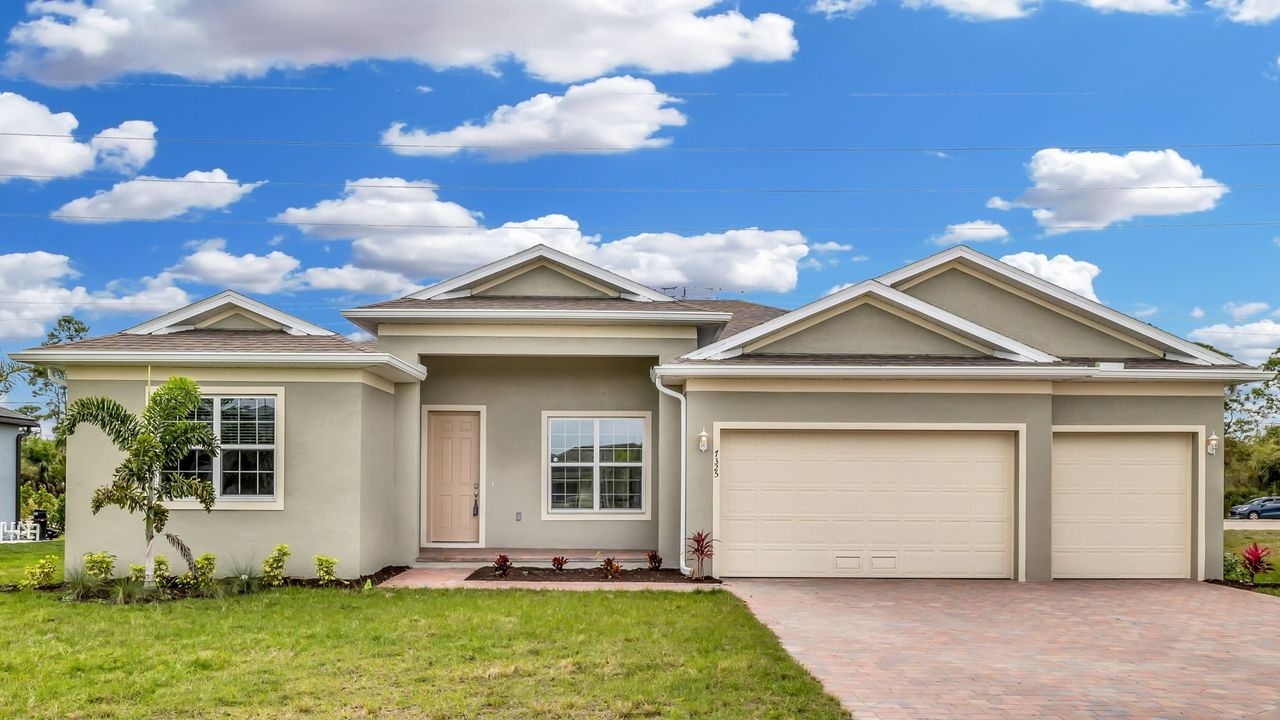 Front exterior of a home in the Cape Coral Spot - Tradition community, located in Cape Coral, FL (Image 2). Front exterior of a home in the Cape Coral Spot - Tradition community, located in Cape Coral, FL (Image 2).