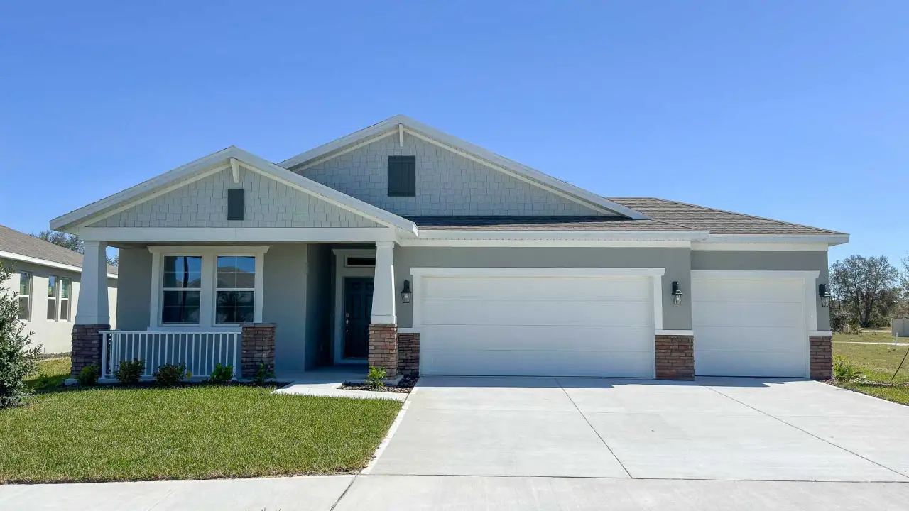 Front exterior of a home in the Tranquility community, located in St. Cloud, FL (Image 2).